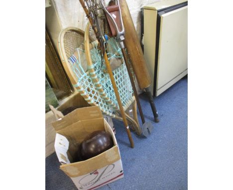 A quantity of vintage sports equipment to include racquets and lawn bowls. Location:RWM 