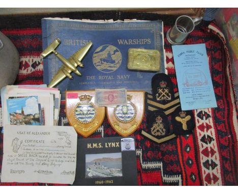 A selection of WWI and later navy related items to include a 1914 brass Christmas box, a brass trench art model of a plane, n