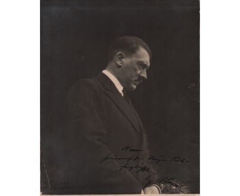 HITLER ADOLF: (1889-1945) Fuhrer of the Third Reich 1933-45. Vintage signed and inscribed 7 x 8.5 photograph of Hitler standi