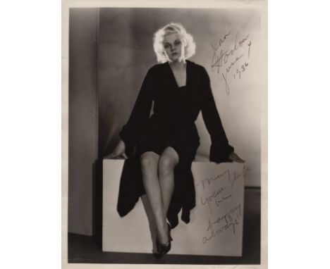 HARLOW JEAN: (1911-1937) American Actress and Sex Symbol. An excellent vintage signed 10 x 13 photograph of Harlow seated in 