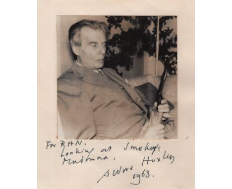 HUXLEY ALDOUS (1894-1963) English Writer. An unusual vintage signed and inscribed 6 x 7 photograph of Huxley seated in a half