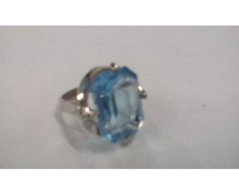 Silver dress ring with large blue gemstone 