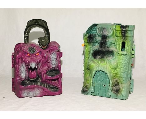 Playworn Mattel He-Man Masters of the Universe Castle Greyskull with broken hinges along with a playworn Mattel He-Man Master
