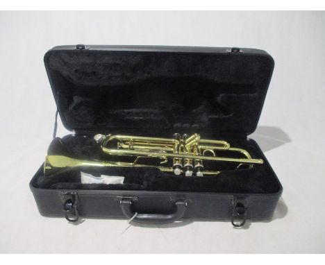 A Stagg Trumpet 77-T (Serial No. ND0418D) in carry case, along with three "How to play Trumpet" books. 