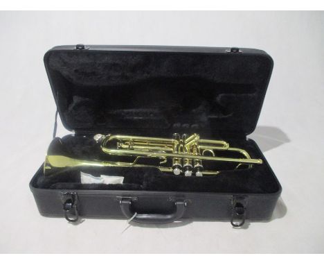 A Stagg Trumpet 77-T (Serial No. ND0418D) in carry case, along with three "How to play Trumpet" books. 