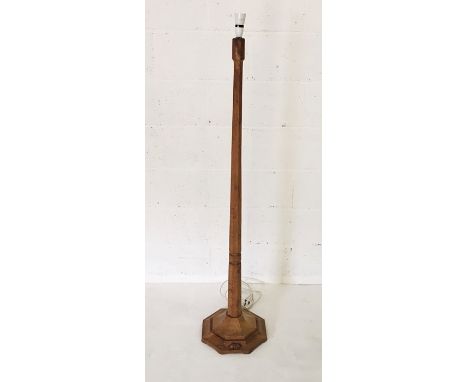 A Robert "Mouseman" Thompson standard lamp with mouse carved onto the octagonal base