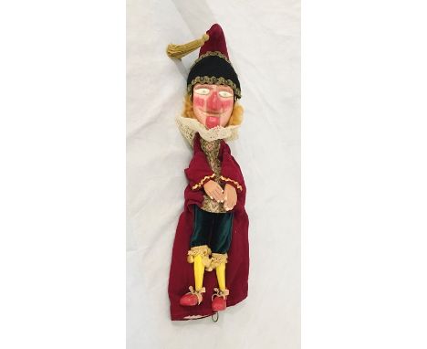 A vintage Punch and Judy "Punch" puppet by Chris Whitehouse with wooden head, hands, legs and feet.