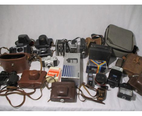 A collection of various cameras, binoculars, camera accessories etc, including Zenit, Praktica, Bolex etc