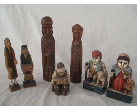 A collection of carved wooden figures along  with a Danish carved chalk figure of an accordion player