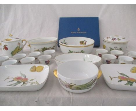 A collection of Royal Worcester Evesham including serving dishes, cake plate, lidded pot, ramekins.