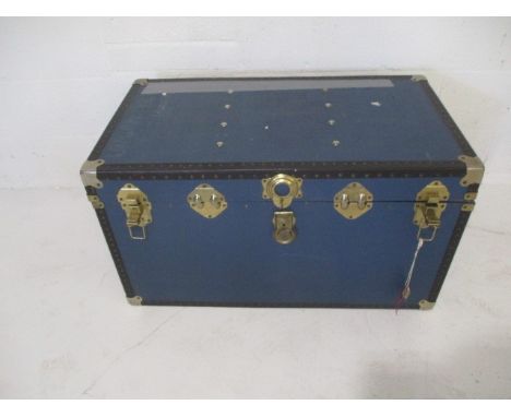 A blue storage trunk - length 92cm, height 50cm, depth 50cm