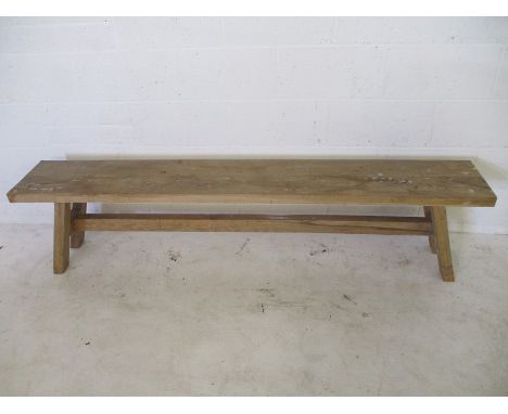 A rustic wooden bench - overall length 195cm