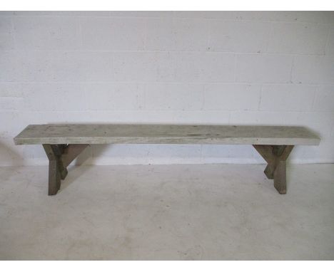 A white painted rustic wooden bench 