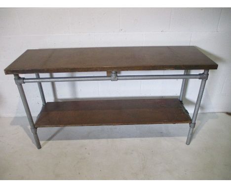 An industrial copper topped console table