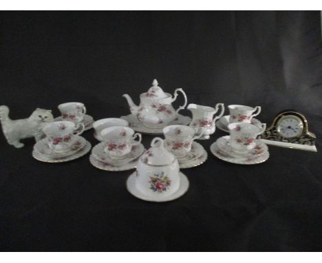 A part Royal Albert "Lavender Rose" tea set ( 1 cup cracked) along with a Worcester clock and a Beswick cat etc.