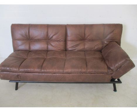 A leather effect sofa bed.