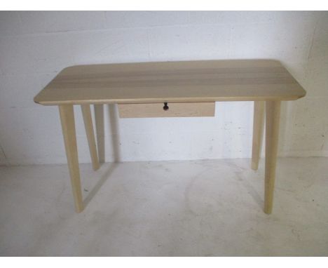 A contemporary console table with single drawer