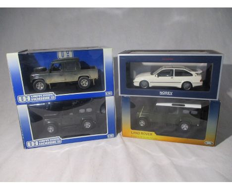 Two Universal Hobbies boxed die-cast Land Rovers including the Defender 110 Pick Up Defender Double Cab &amp; Defender 90 Sta