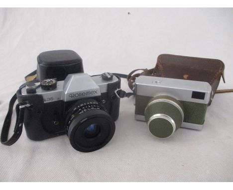 A Rolleiflex SL35 camera along with a Carl Zeiss Jena Werra camera, with olive green body and fitted with Carl Zeiss Jena Tes