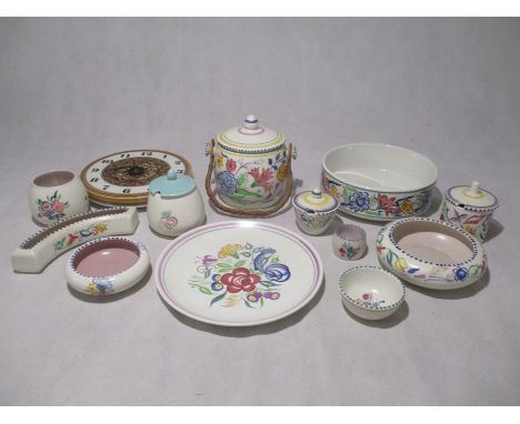 A collection of Poole Pottery including a biscuit barrel, pots, plate, bowl etc