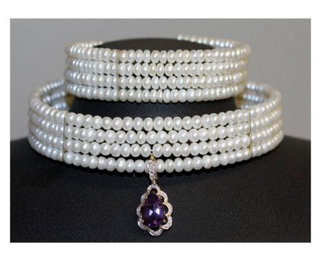 A FOUR ROW PEARL NECKLACE set with a 9ct white gold and pear shaped drop pendant and a BANGLE.