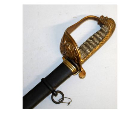 A NAVAL CUTLASS with shagreen handle and metal scabbard. 3ft 4ins long.