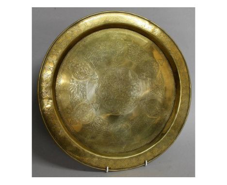 A 19TH CENTURY ISLAMIC CIRCULAR DISH with calligraphy. 15ins diameter.