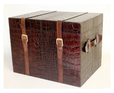 A LEATHER MOCK CROCODILE TRUNK with straps. 1ft 4ins wide.