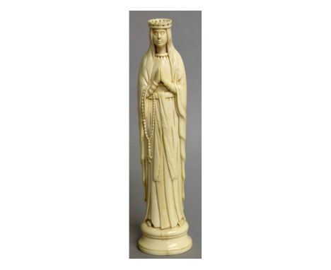 AN EARLY 19TH CENTURY CARVED EUROPEAN IVORY MADONNA, "Virgin at Prayer".  7.75ins high.