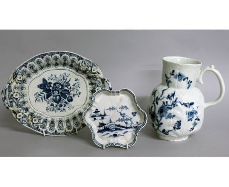 AN 18TH CENTURY WORCESTER DUTCH JUG painted in blue with Cabbage Leaf Jug Florals, workman's mark, two rim chips, a Worcester