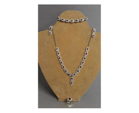 A VERY GOOD REAL RUBY SILVER SET FOUR PIECE, comprising necklace, bracelet, pair of earrings and ring.