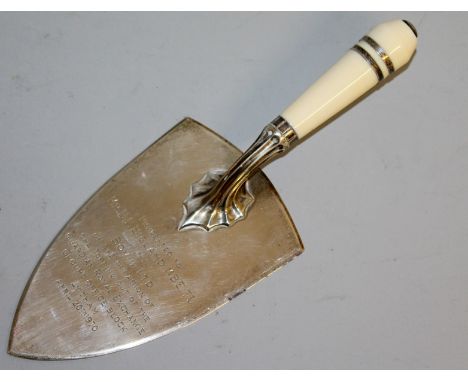 AN IVORY HANDLED PRESENTATION SILVER TROWEL, engraved "PRESENTED TO MR E. F. BILLAND MBE TD by BOVIS LTD. ...................