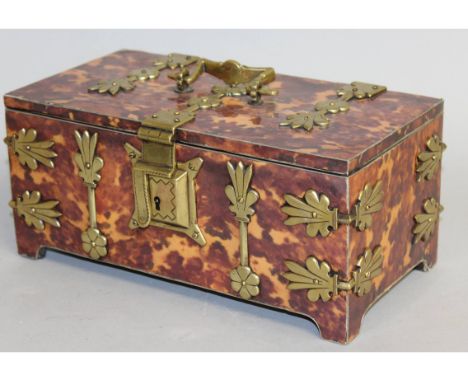 A GOOD LARGE TORTOISESHELL CASKET SHAPED TEA CADDY with brass mounts and fitted interior. 10.5ins wide.