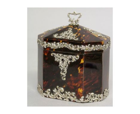 A SUPERB QUALITY VICTORIAN SILVER MOUNTED TORTOISESHELL TEA CADDY of octagonal form, with inner lid and a caddy spoon.  4.5in