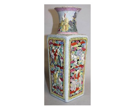 AN EARLY 20TH CENTURY CHINESE PIERCED & MOULDED FAMILLE ROSE PORCELAIN VASE, of square section, the sides decorated in relief