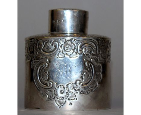 AN OVAL TEA CADDY AND COVER with repousse decoration. Sheffield 1917.