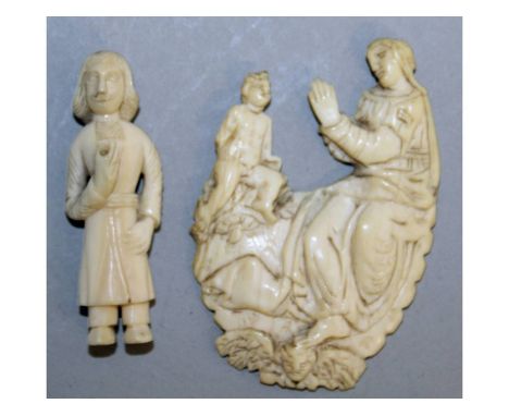 A MINIATURE EUROPEAN IVORY FIGURE OF A MAN, 1.75ins high, and a CARVED PLAQUE, Madonna and Child (2).