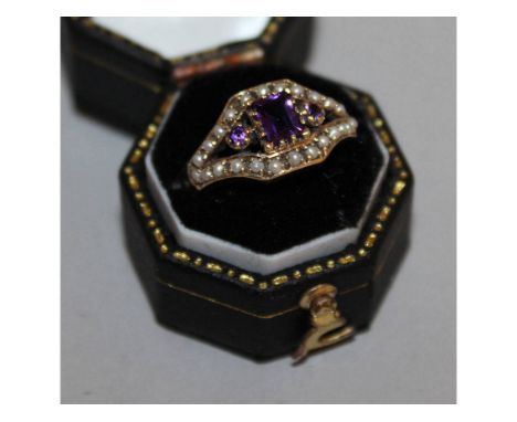 A 9CT YELLOW GOLD AMETHYST AND PEARL RING.