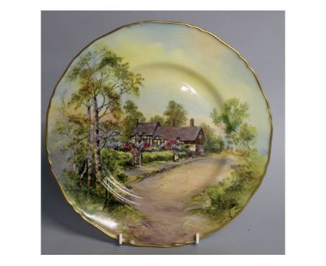 A ROYAL WORCESTER PLATE decorated with Ann Hathaway's Cottage, signed, date code for 1959.