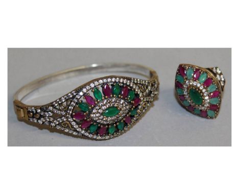 A GOOD SILVER AND GILT BANGLE AND RING.