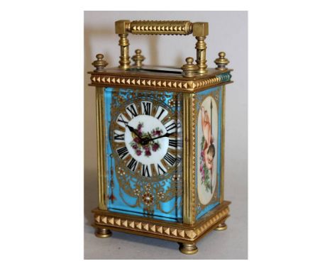 A BRASS CARRIAGE CLOCK with painted Sevres type panels. 6ins high.