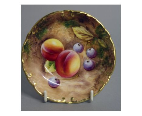A ROYAL WORCESTER PIN DISH painted with fruit by Roberts, black mark, date code 1959.
