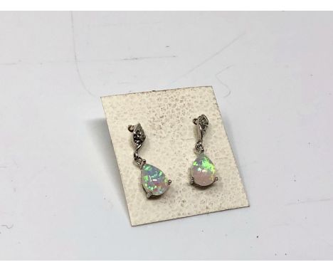 A pair of opal effect earrings 