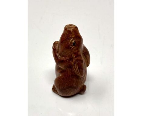 A carved Chinese hardwood netsuke - large rabbit 