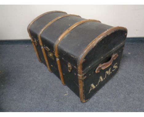 A wooden bound dome top trunk 