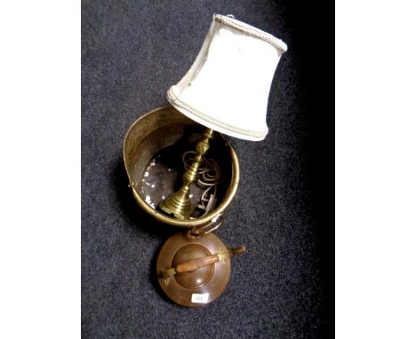 A hammered brass swing handled coal bucket together with brass table lamp and a copper kettle 