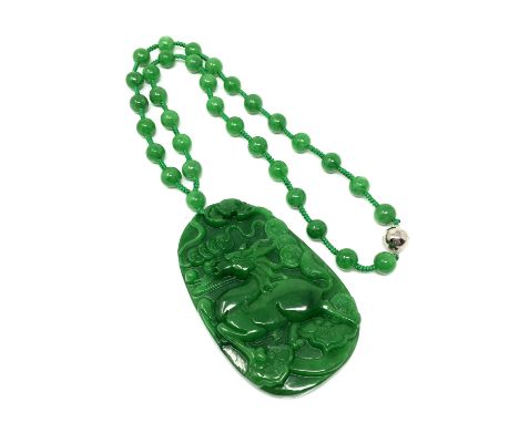 A large good quality jade pendant and necklace 