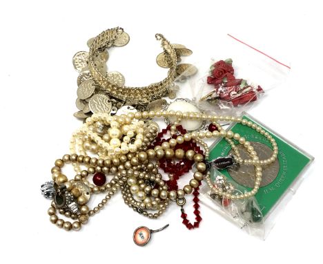 A quantity of costume jewellery, cuff bangle, commemorative coin  