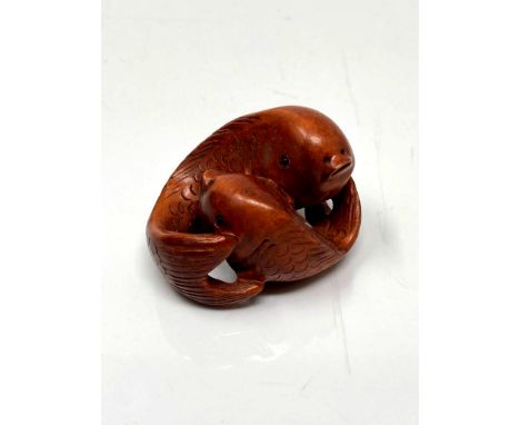 A carved Chinese hardwood netsuke - Two carp 