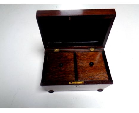 A Regency rosewood sarcophagus form tea caddy   